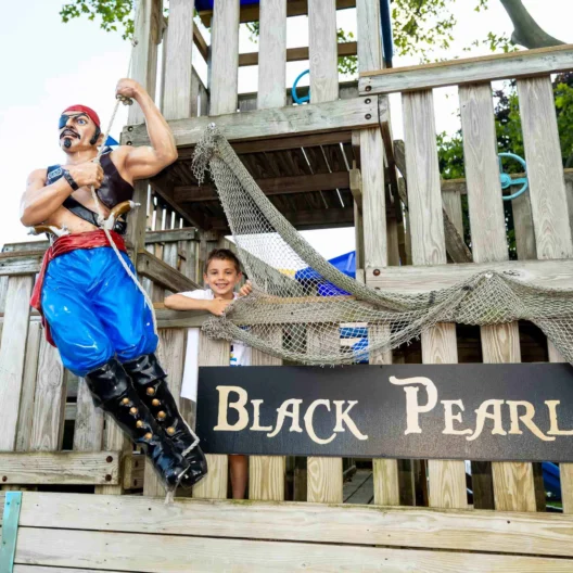 A camper at the black pearl pirate-themed playspace.