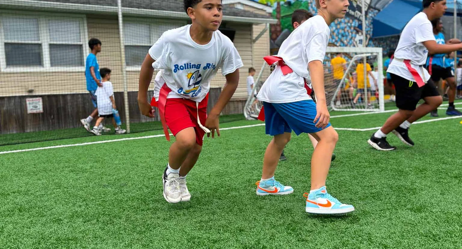 Navigator campers playing flag football.