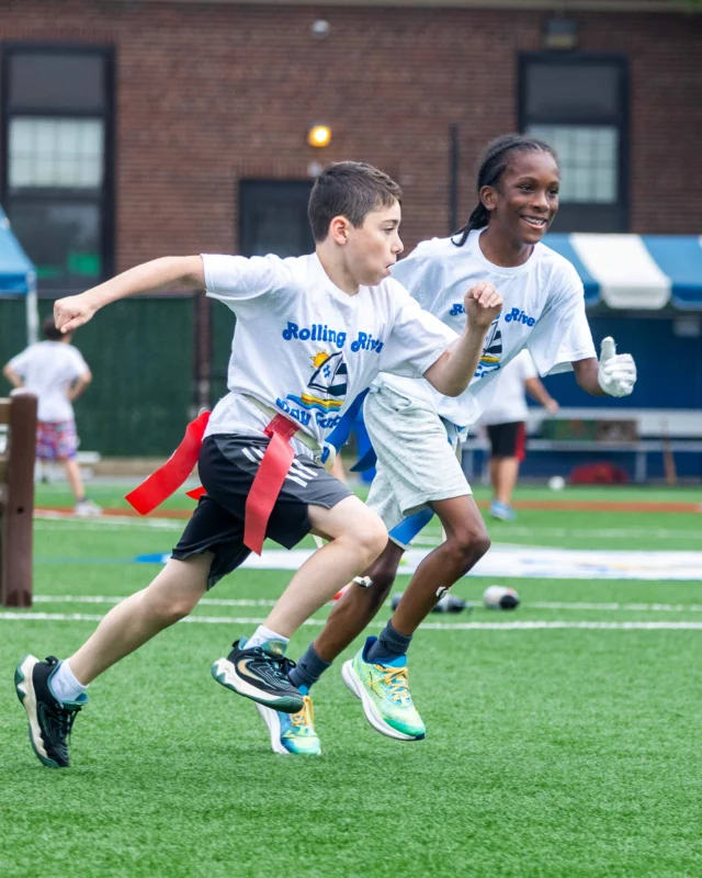 Navigator division campers playing soccer.