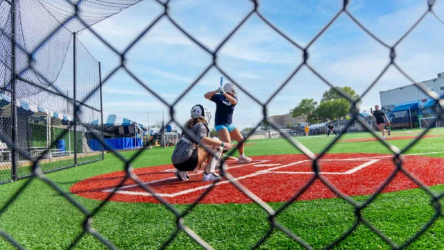 Campers playing baseball.