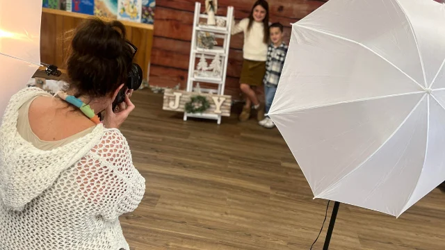 A woman taking photos of campers.