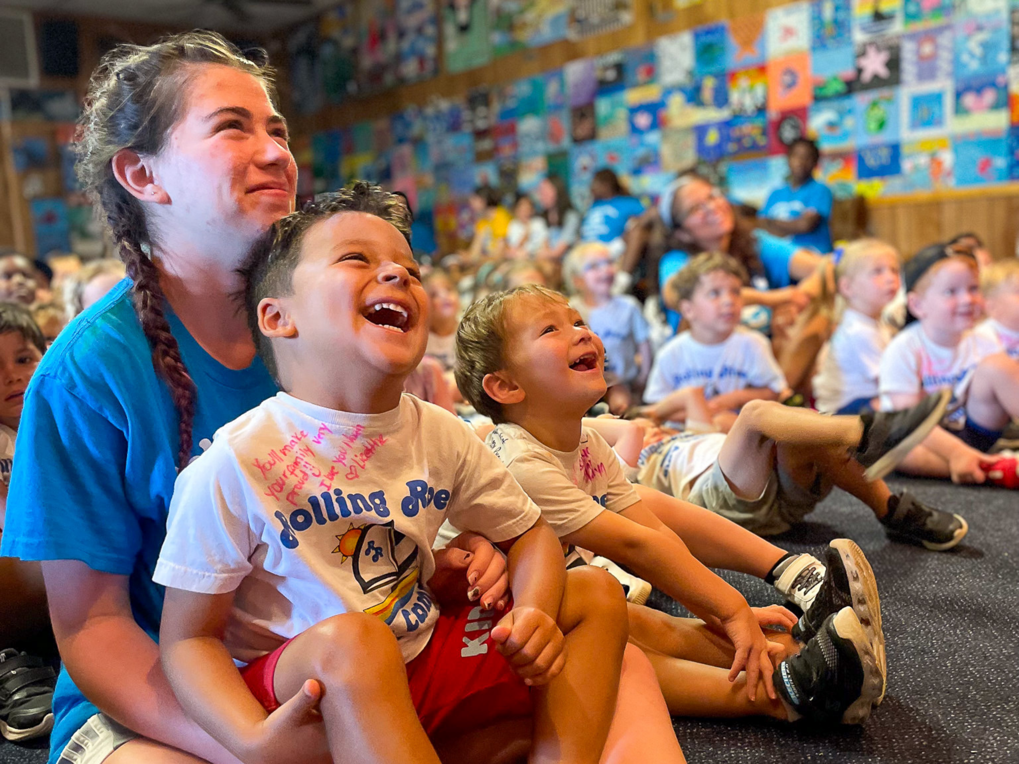 Young campers watching the stage.