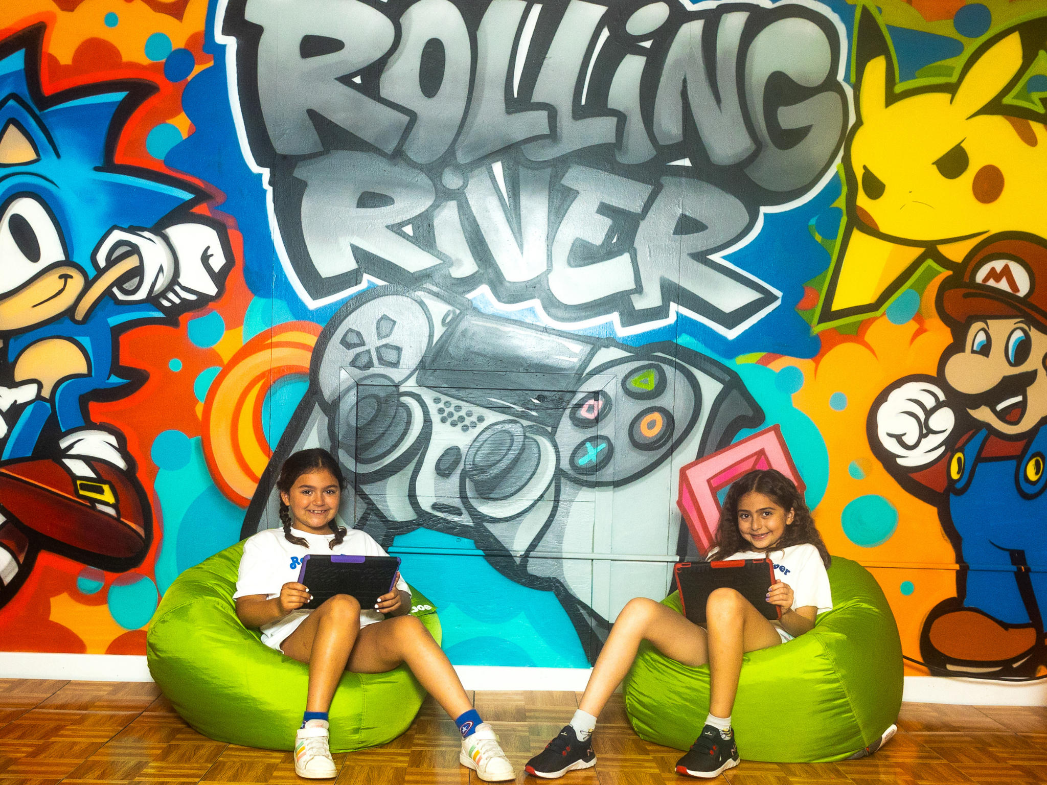 Two campers sitting in bean bag chairs.