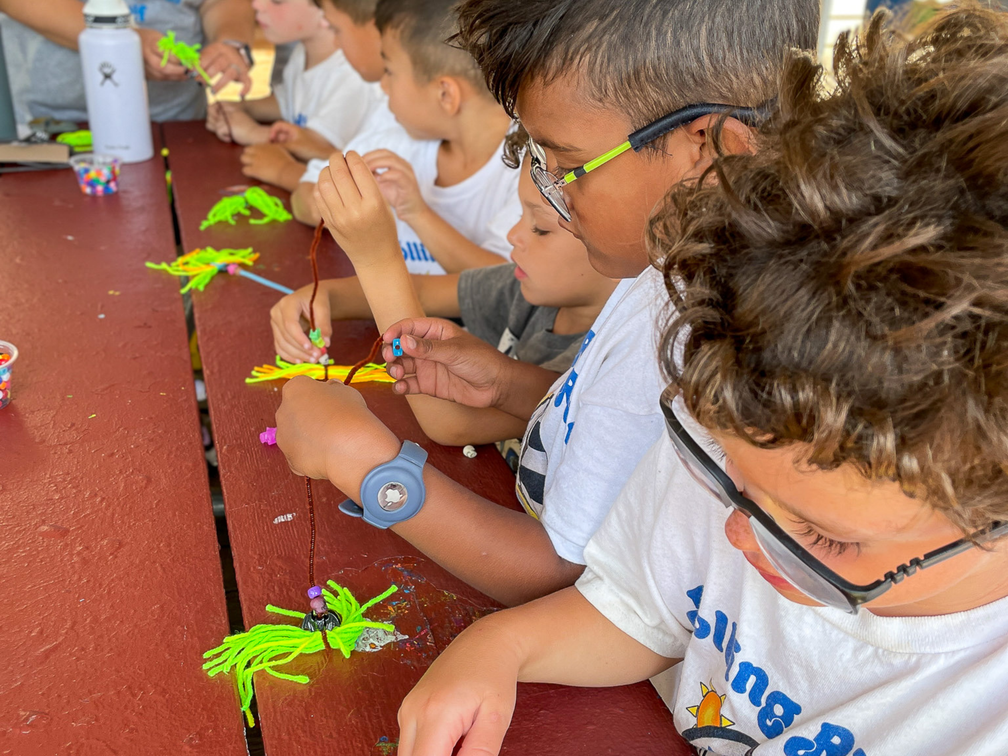 A camper working on arts and crafts.
