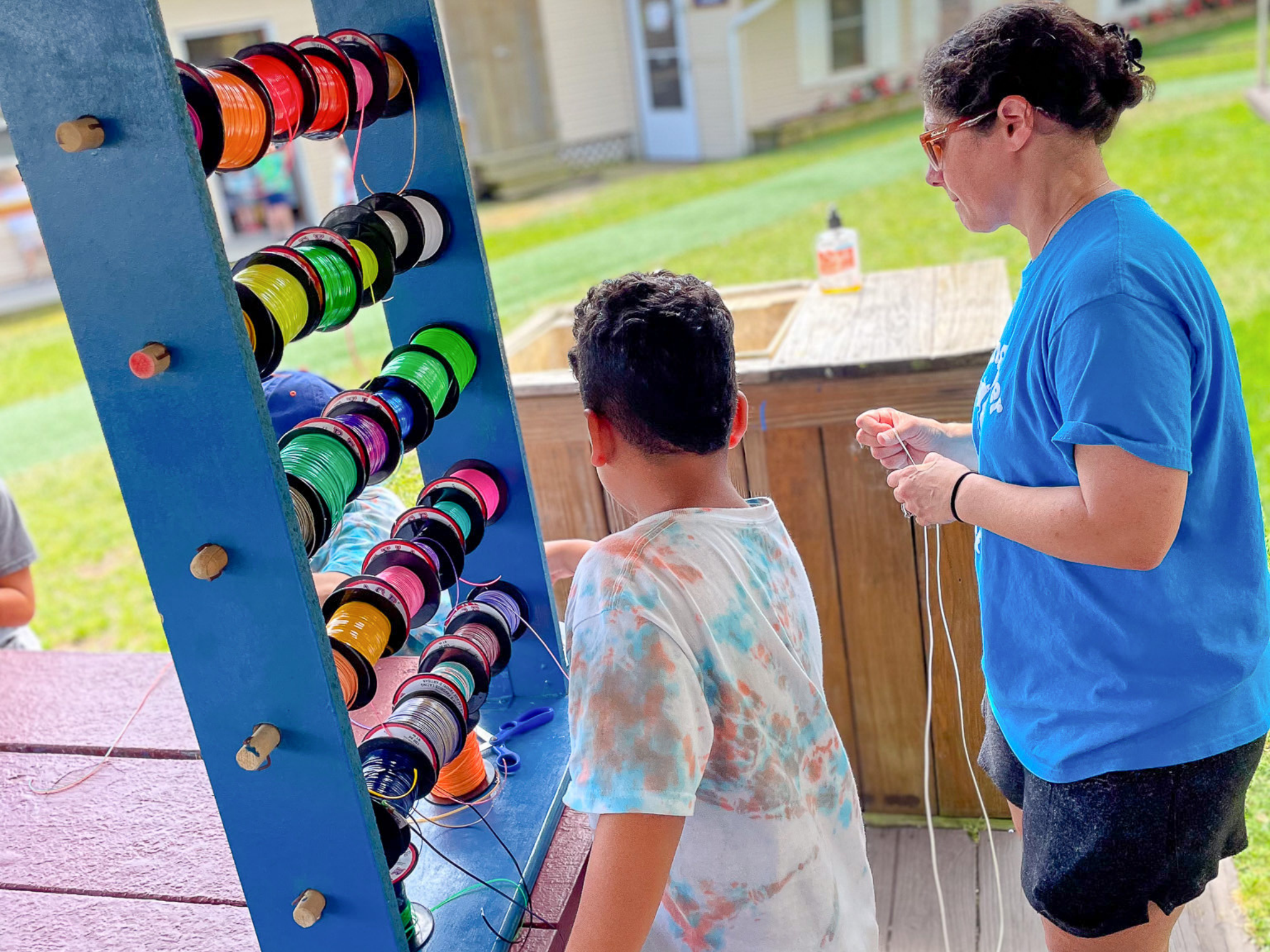 A camper working on arts and crafts.