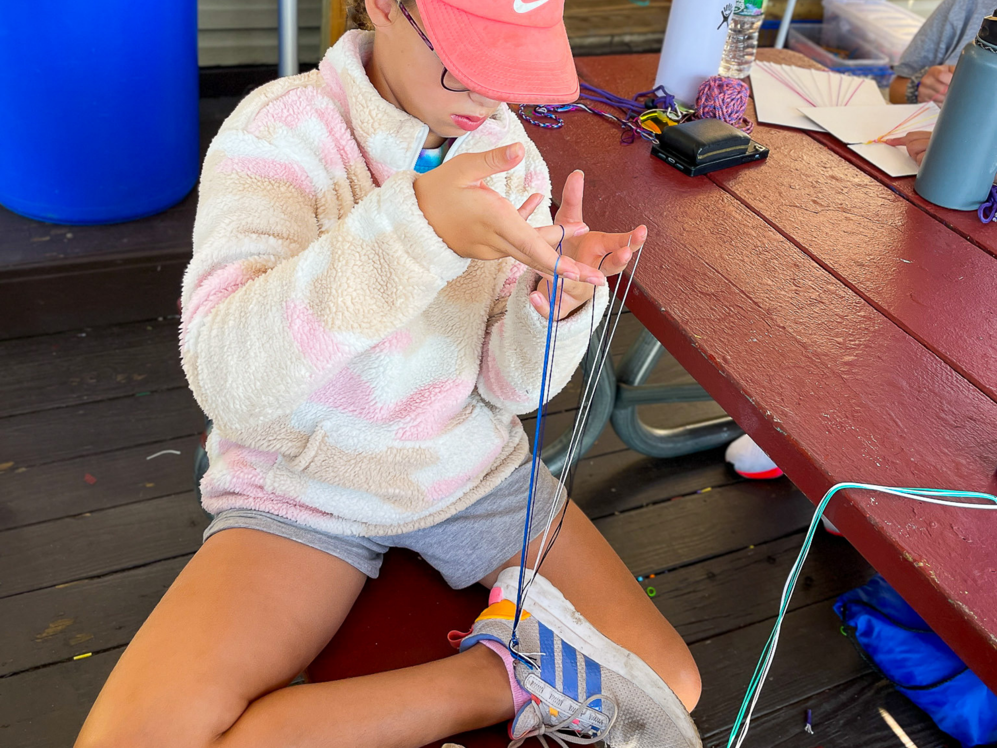 A camper working on arts and crafts.