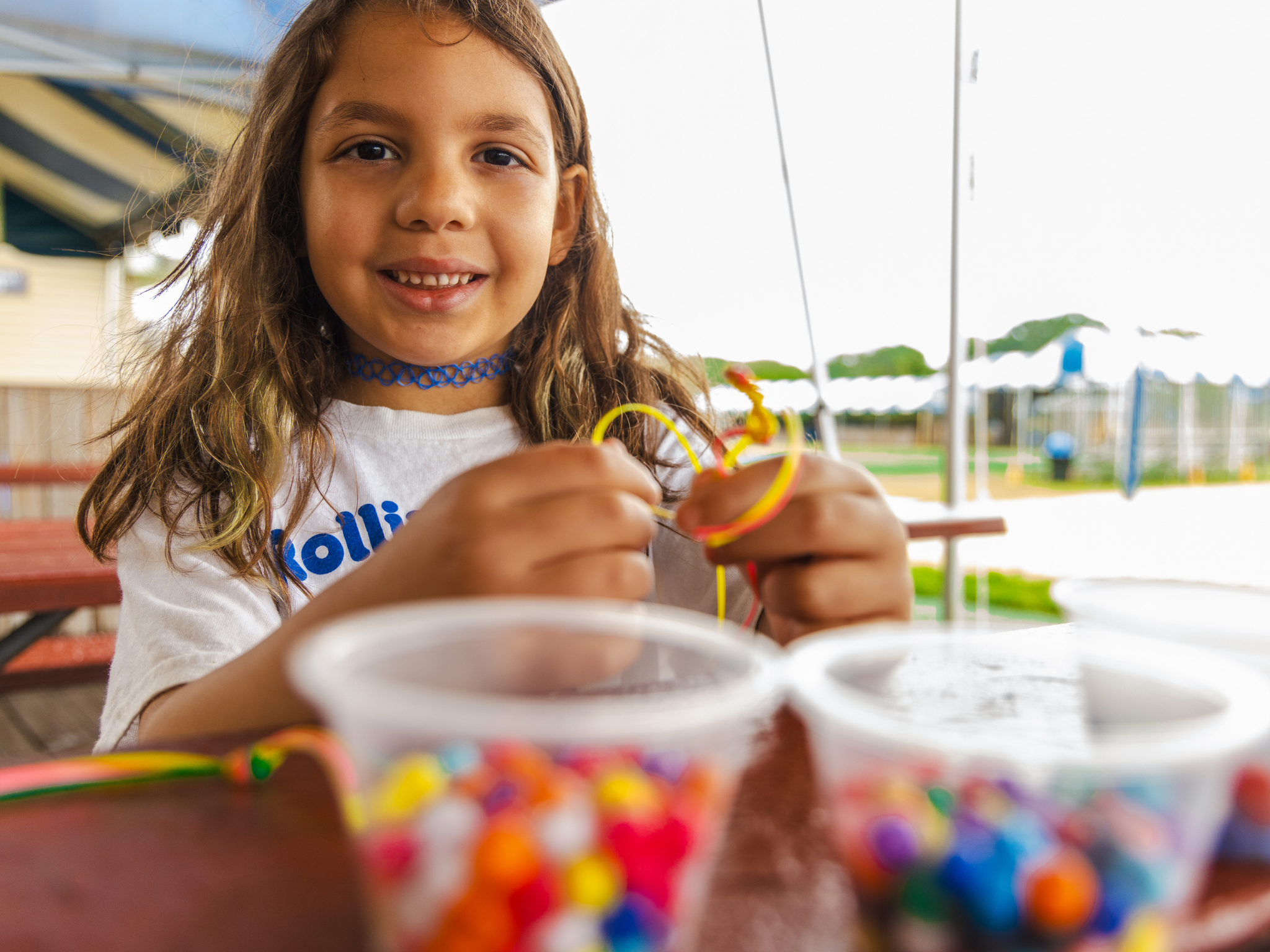 A camper working on arts and crafts.