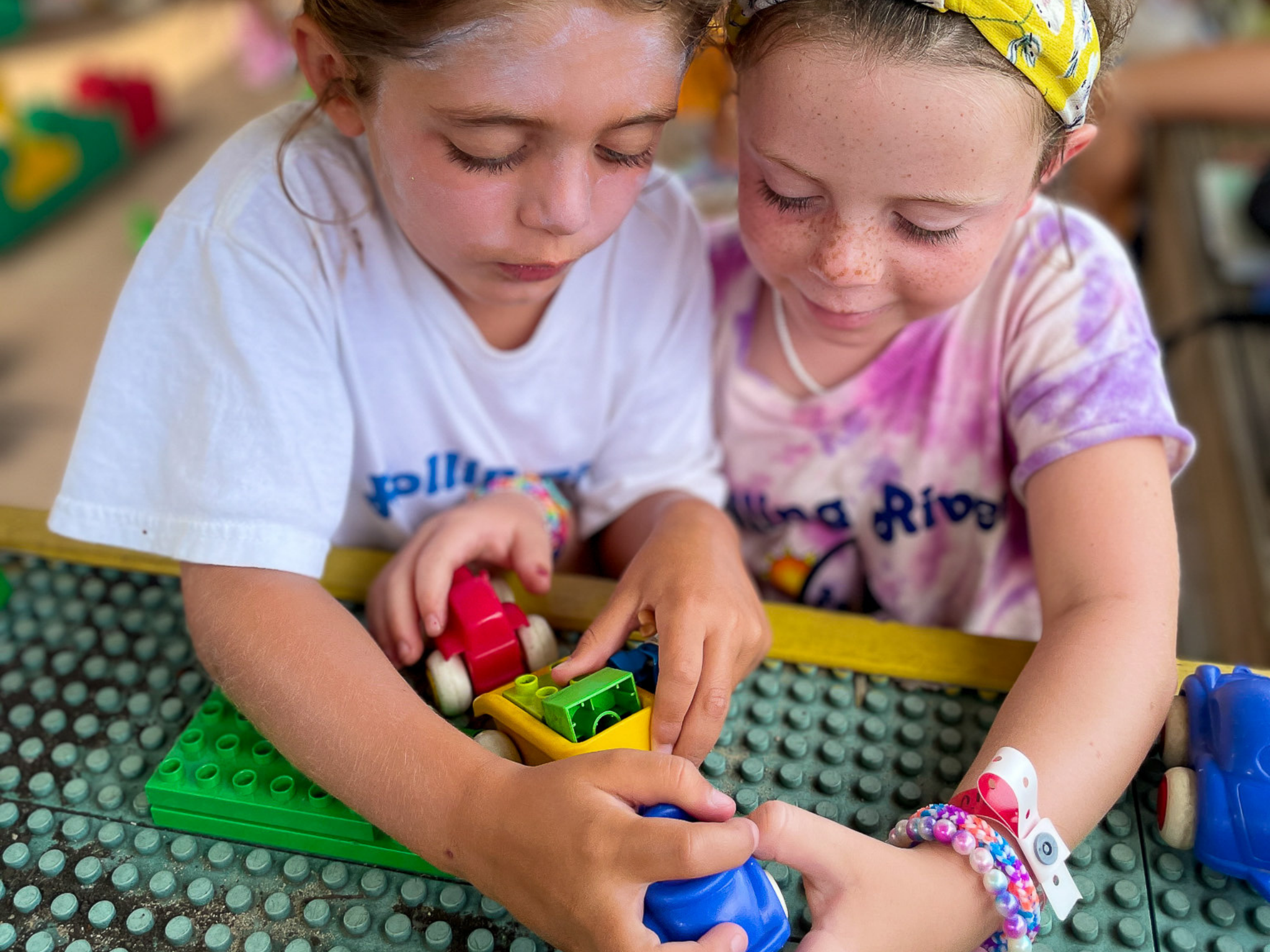 Two young campers playing with Barnacle blocks.
