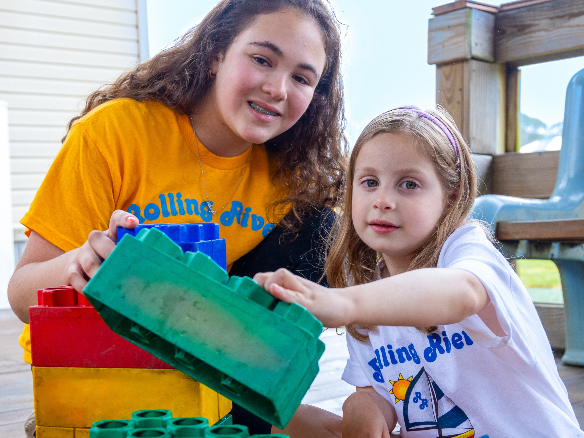 Two campers playing with barnacle blocks.