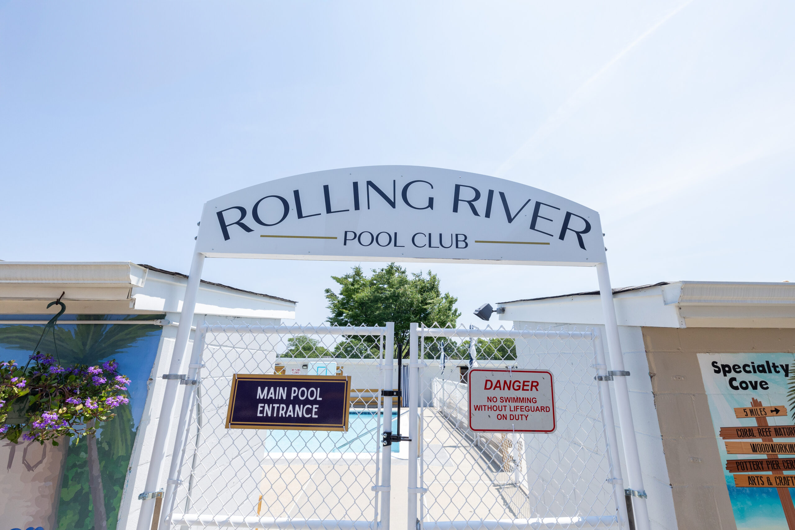 Rolling River pool club entrance sign.