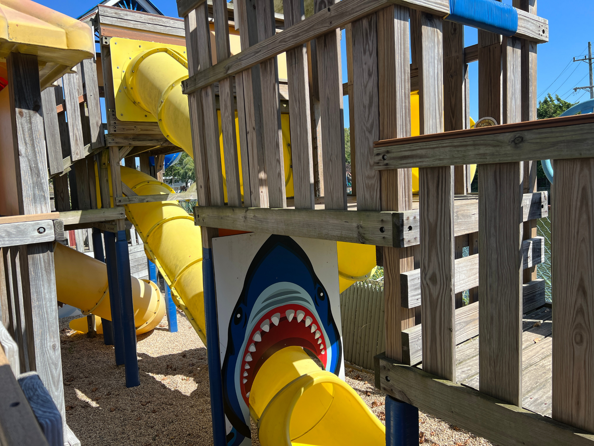 Multi-level pirate themed playground located in Specialty Cove. Includes tunnels, swings and slides with pirate decor. Features interactive scavenger hunt built in to the playground.