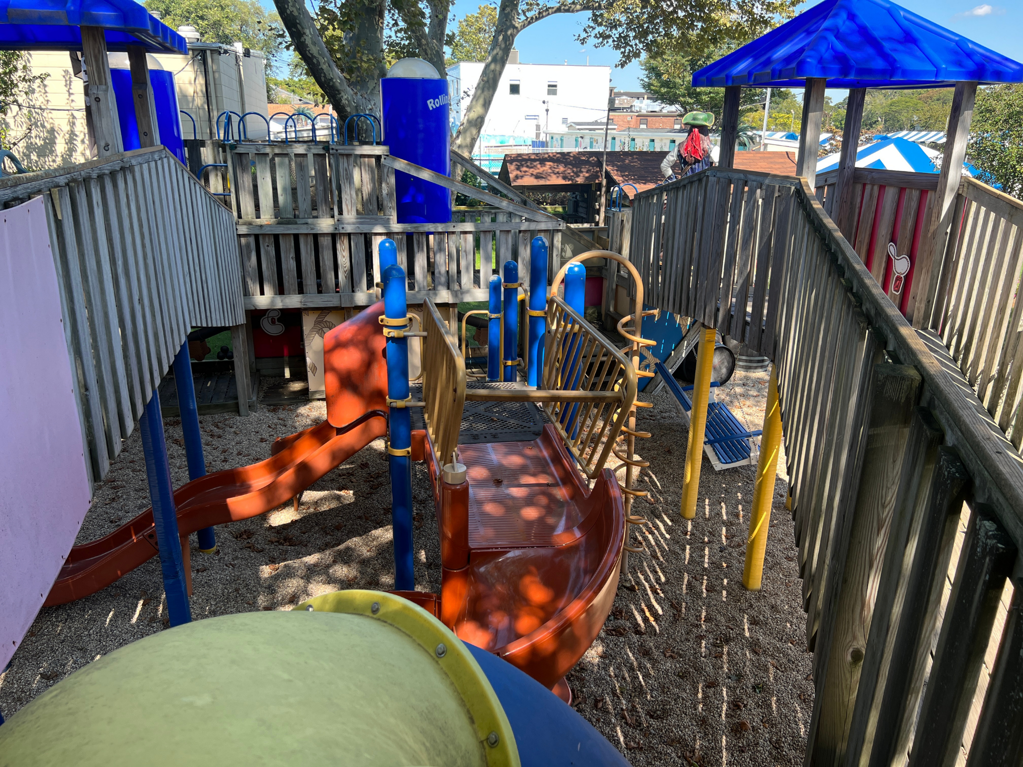 Multi-level pirate themed playground located in Specialty Cove. Includes tunnels, swings and slides with pirate decor. Features interactive scavenger hunt built in to the playground.