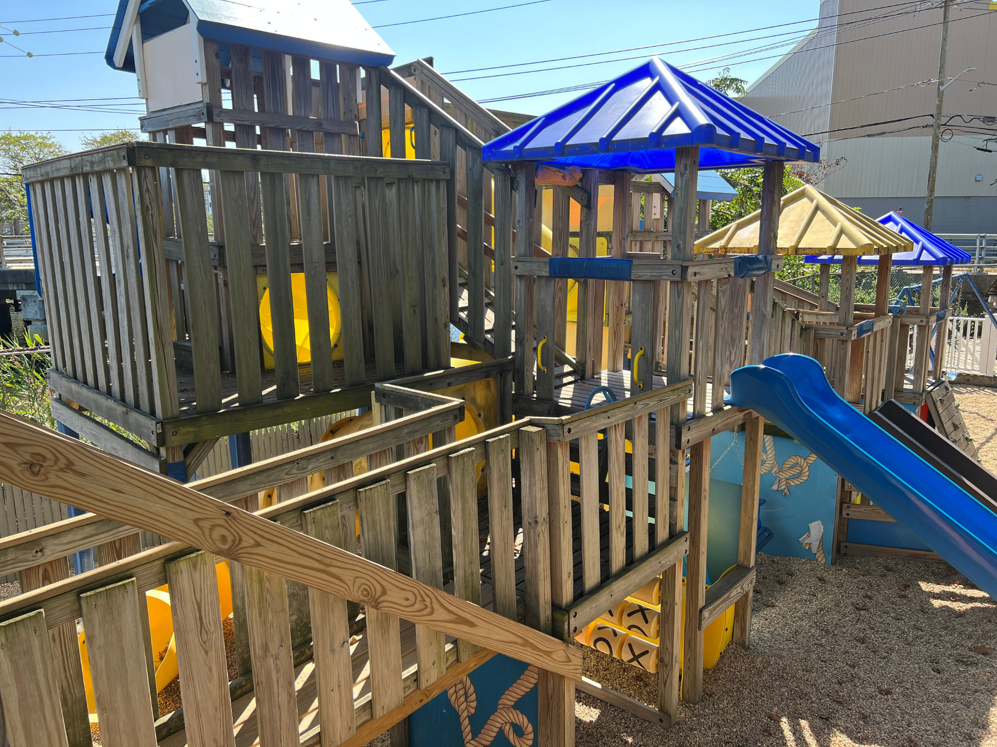 Multi-level pirate themed playground located in Specialty Cove. Includes tunnels, swings and slides with pirate decor. Features interactive scavenger hunt built in to the playground.