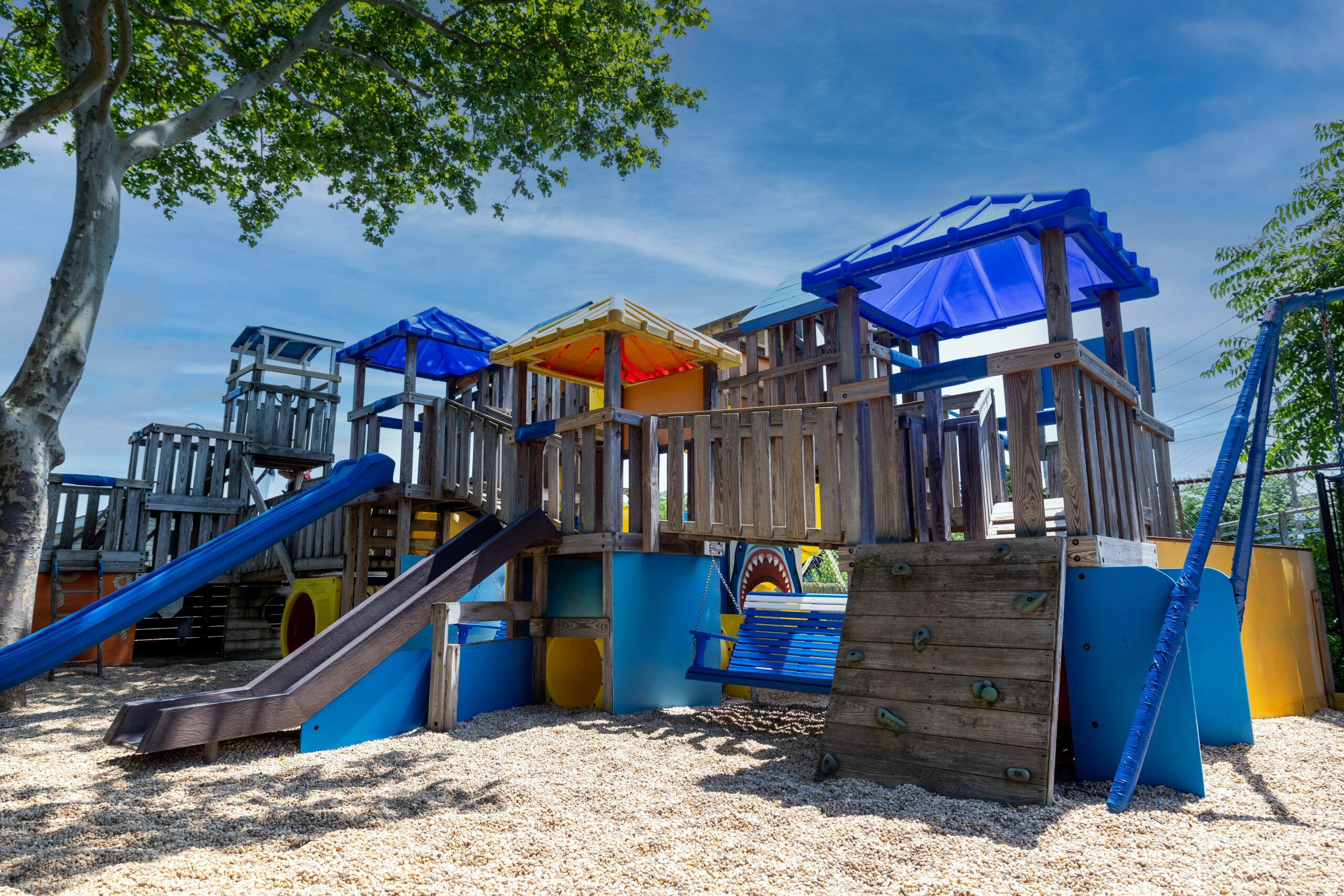 Multi-level pirate themed playground located in Specialty Cove. Includes tunnels, swings and slides with pirate decor. Features interactive scavenger hunt built in to the playground.