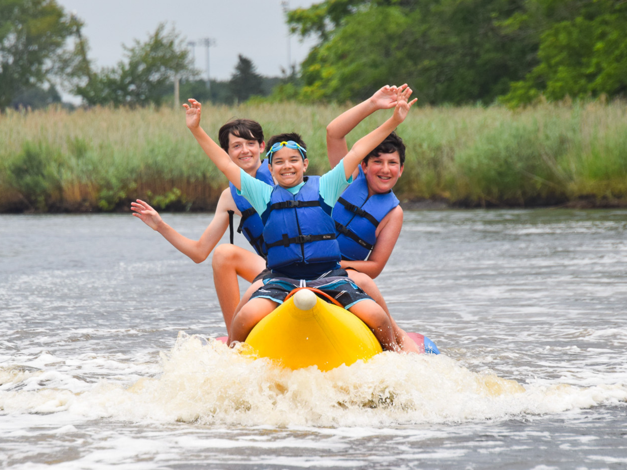 Three campers on a banana boat.