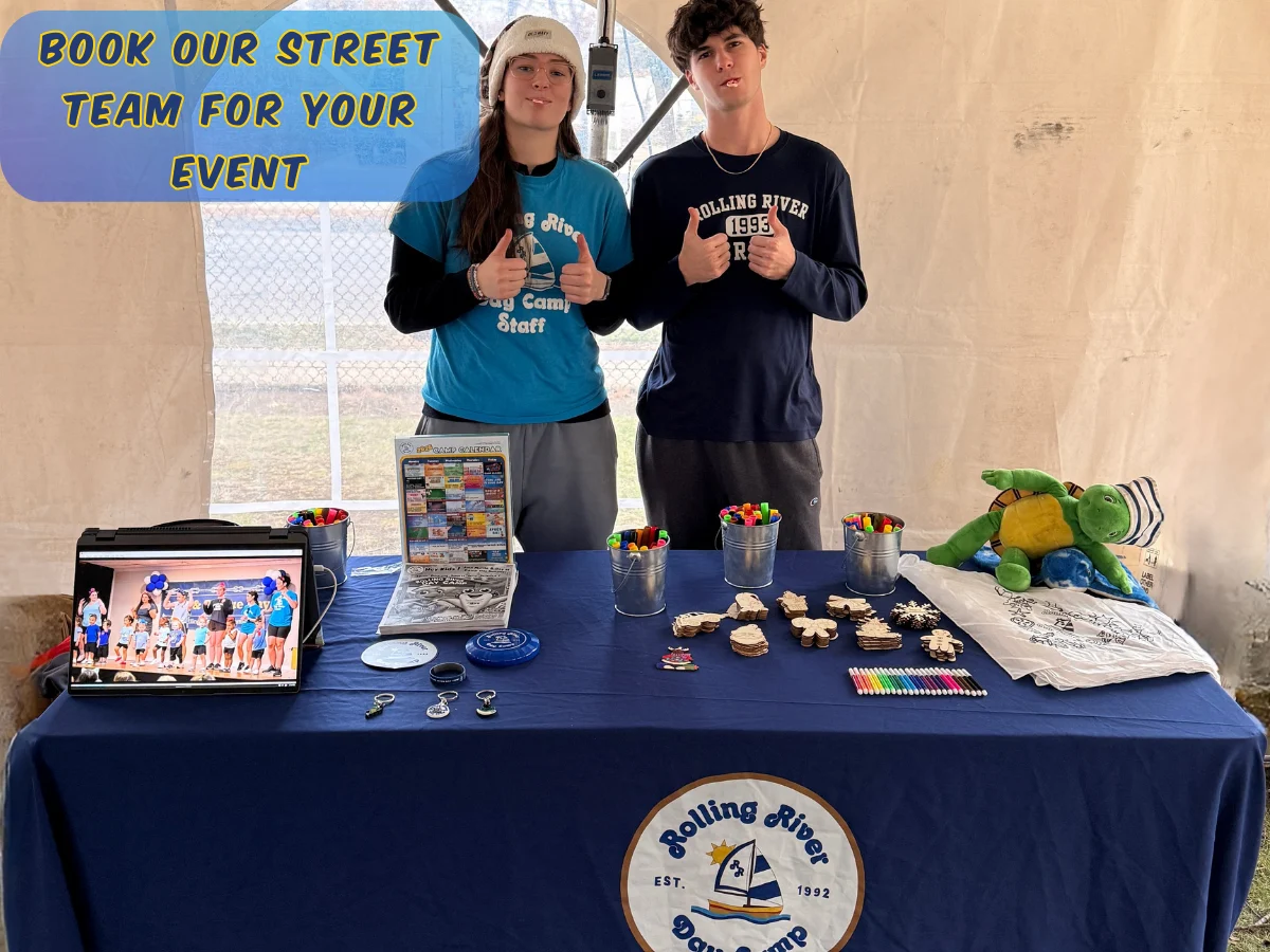 Rolling River Day Camp street team hosts an event table with games