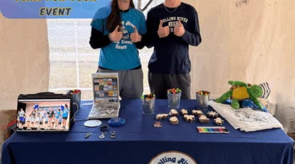 Rolling River Day Camp street team hosts an event table with games