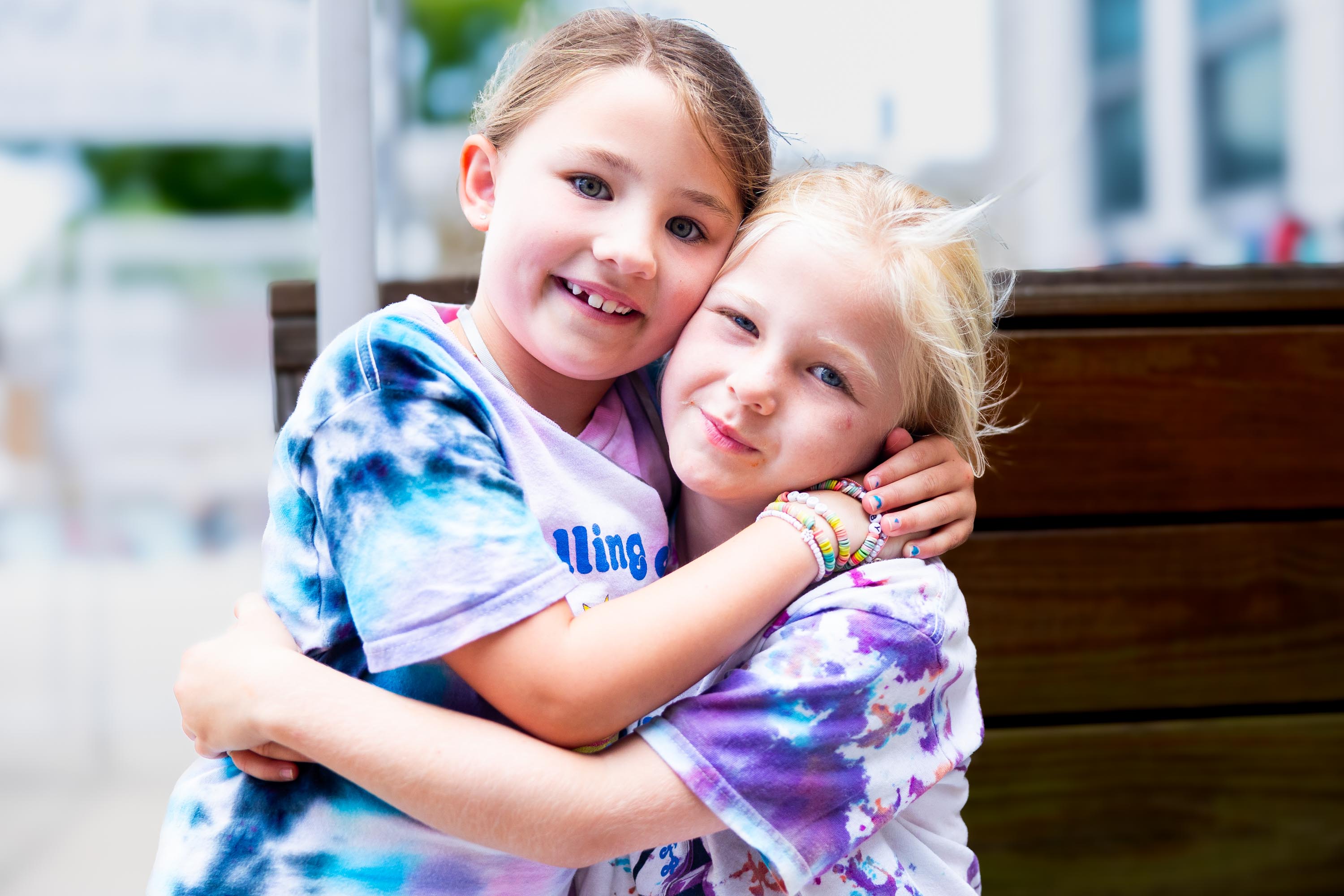 Two campers hugging each other.