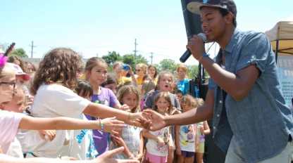 Trevor Jackson performing in front of campers.