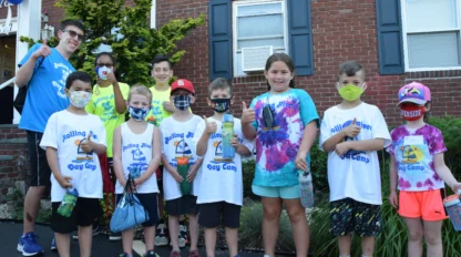 A group of campers wearing masks.