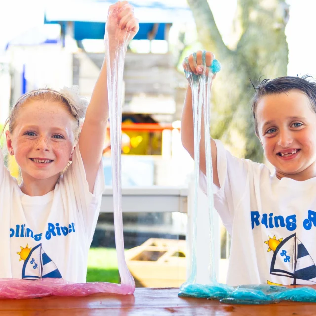 Two campers playing with slime.