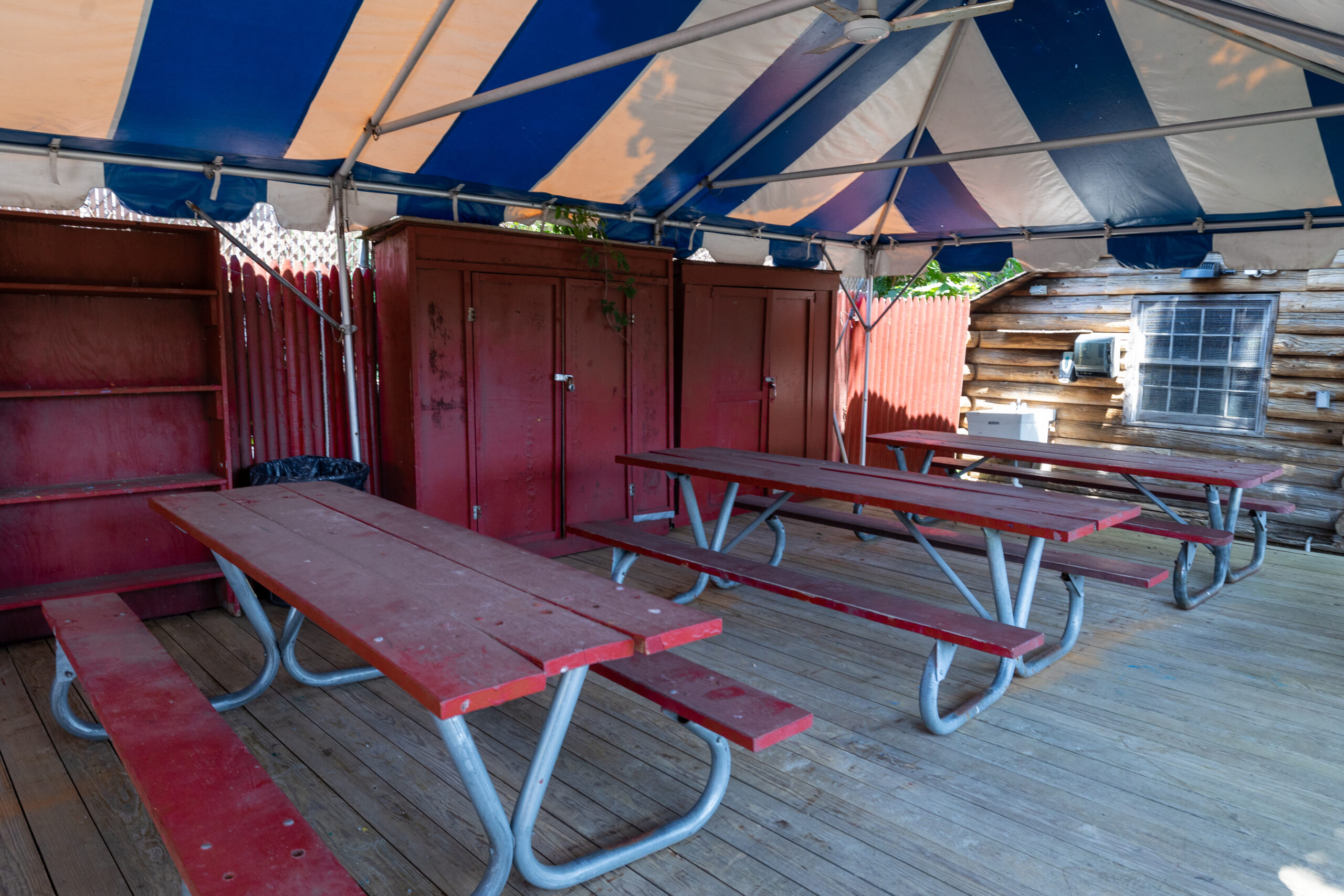 Dark red benches outside Hammerhead Haven.