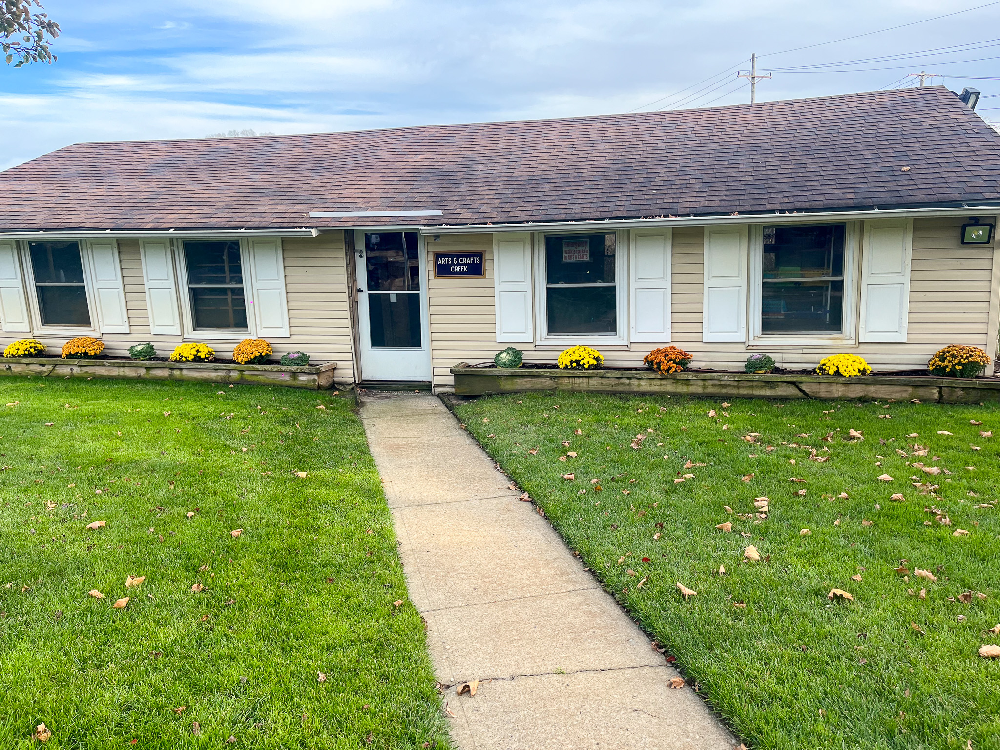 The outside of the arts and crafts creek building.