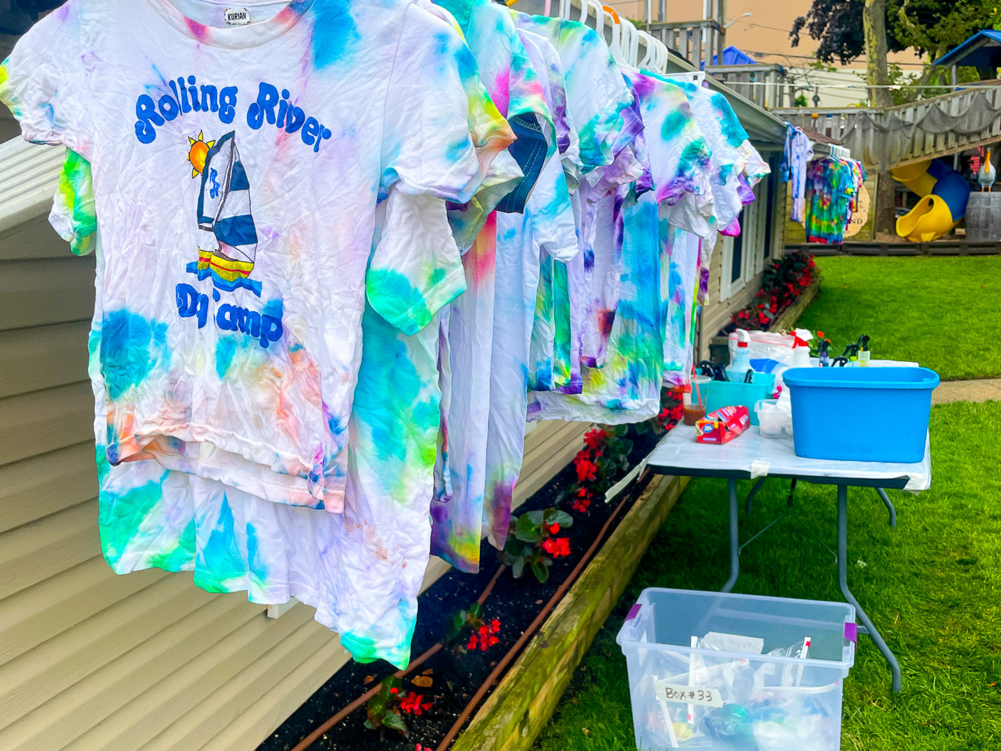 Tie dye Rolling River Day Camp t-shirts.