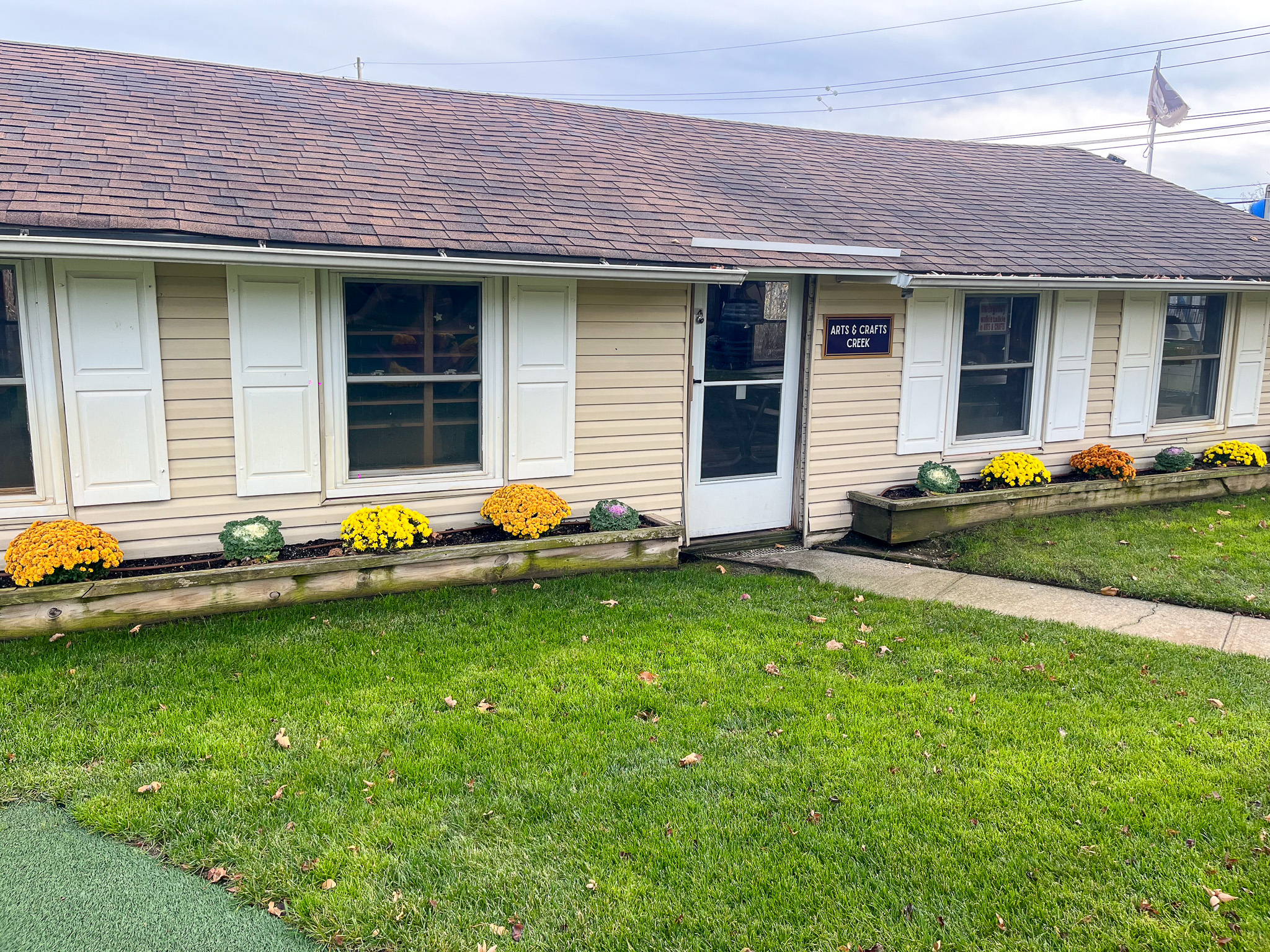 The outside of the arts and crafts creek building.