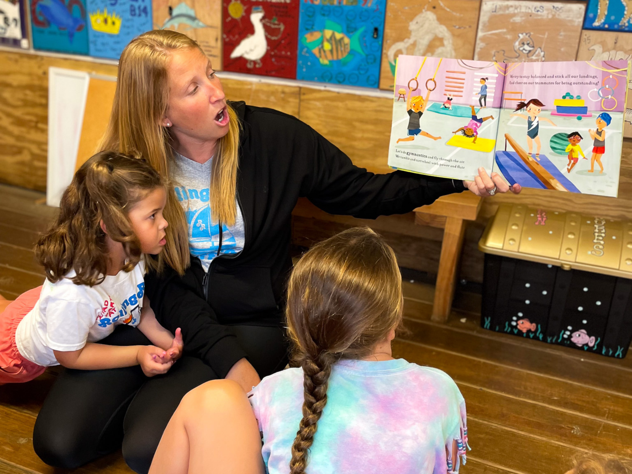 Young campers alongside a camp instructor.