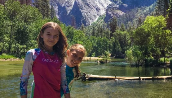 Smiling by clear river on Taste of Quest