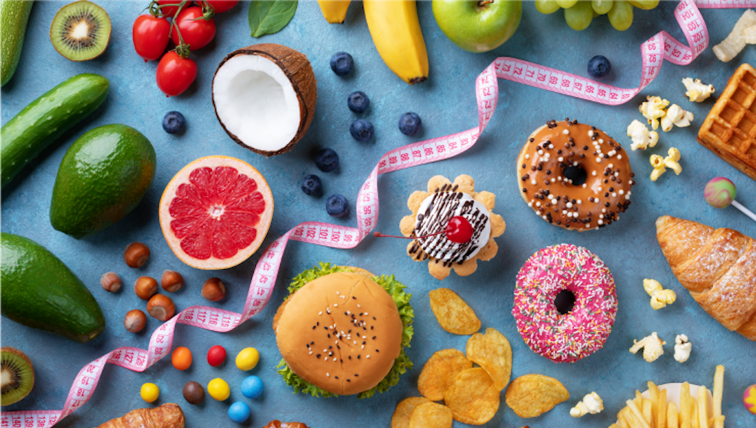 Healthy foods (fruits, vegetables) on one side of pictures and unhealthy foods (donuts, treats) on the other side, separated by a pink ribbon.