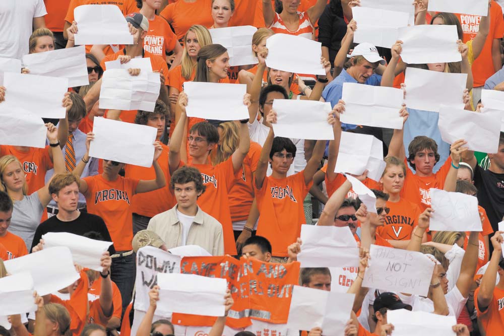 Students holding up blank signs in protest of the policy prohibiting signs