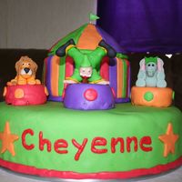 Img_0052.jpg circus cake for 6 year old. Bottom is white single layer cake sitting on top of the cake pan I baked it in, tent is chocolate, figures are...