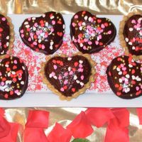 Chocolate Hearts These are chocolate coffee heart cakes filled with peanut butter and those with heart-shaped sprinkles are chocolate spice cakes.
