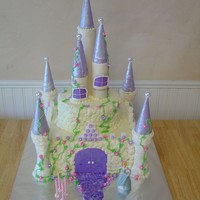 Castle Cake Castle cake for a 4 year old. 12" square and 8" round. Corner turrets are icecream cones covered with MMF. Used paper towel rolls...