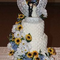 Weddingcakesized2.jpg This is a basket weeve cake I made for my grandsons wedding. I used the almond sourcream cake and wiltons white buttercream frosting and...