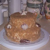 Sand Castle Carrot Cake with cream cheese icing covered in "sand" Also has chocolate shells.