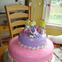 Fairy Cake Fairy Cake for daughter's 8th Bday. Fondant hand-molded fairies, mmf covered cake, top cake glazed with pearl glaze for the shine....
