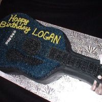 Guitar Cake 2 layer Chocolate cake, Chocolate icing, Chocolate pudding filled, Gum paste details. My 3rd cake! Pretty proud!