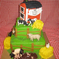 Farm Fun Cake is decorated in buttercream with Fondant accents. Animals are plastic.