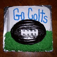 Colts Superbowl Cake The ball looks black in the picture but it was actually Dark Chocolate. I sent this cake to work with my husband. I am sure they are...