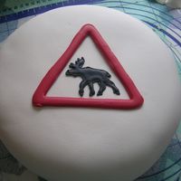 Elk Sign Marzipan covered cake filled wit whipped cream and raspberries.