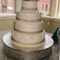 Bethany's Wedding Cake stacked wedding cake using a pale green ribbon, and hydrangeous.