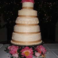 Megan's Wedding Cake Round stacked layers, 16, 14, 12, 10 and a 6. Peonies were used around the cake