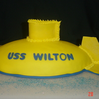 Uss Wilton This submarine cake is covered in fondant and formed with the Wilton football shaped pan. The fins are made from dried fondant.