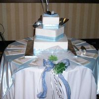 Crystal & Matt 3 tier buttercream, top and bottom layers are white and middle is chocolate. Topper is made to the bride and groom's favourite cars.