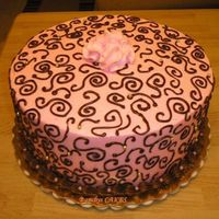 Pink And Brown Swirls Pink and Brown swirl cake with dragees.