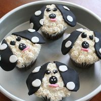 Doggie Cupcakes Frosted in marshmallow buttercream with fondant accents.