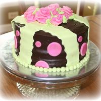 Maddies' Cake My first attempt at ribbon roses. Chocolate cake, with chocolate fudge filling and chocolate ganache icing. Fondant accents.